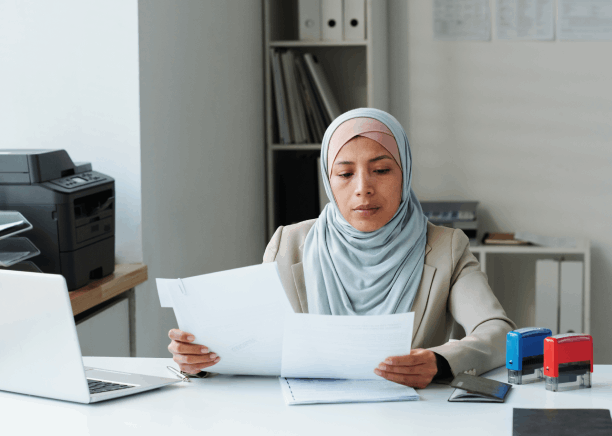 A native linguist translates a lease agreement as Arabic Translation Services in Texas support real estate negotiations.