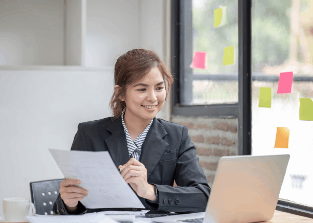 A translator checks a purchase contract line by line while Vietnamese Translation Services in Texas handle real estate.
