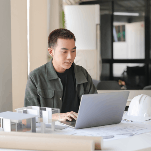 An engineer reviews a machine manual using Chinese Translation Services in Texas for clear, technical terminology.