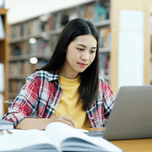 A student checks a translated transcript packet as Spanish Translation Services in Texas prepare academic documents.