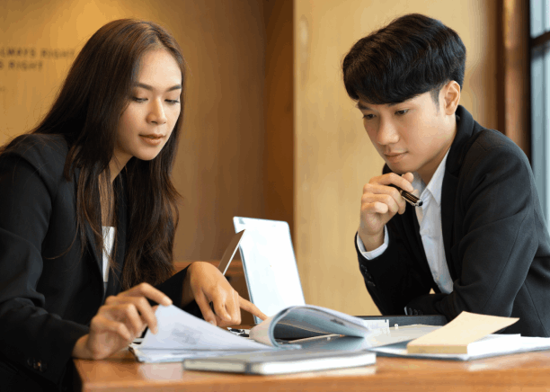 A translator compares an English deed to a Chinese version from Chinese Translation Services in Texas for real estate.