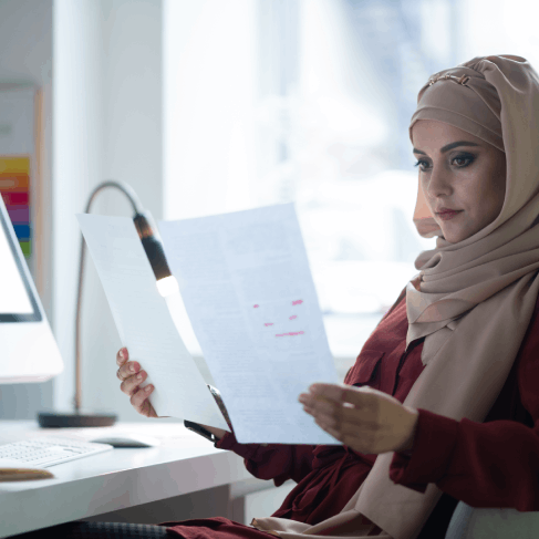A translator checks CAD drawings and labels, using Arabic Translation Services in Texas for technical engineering documents.